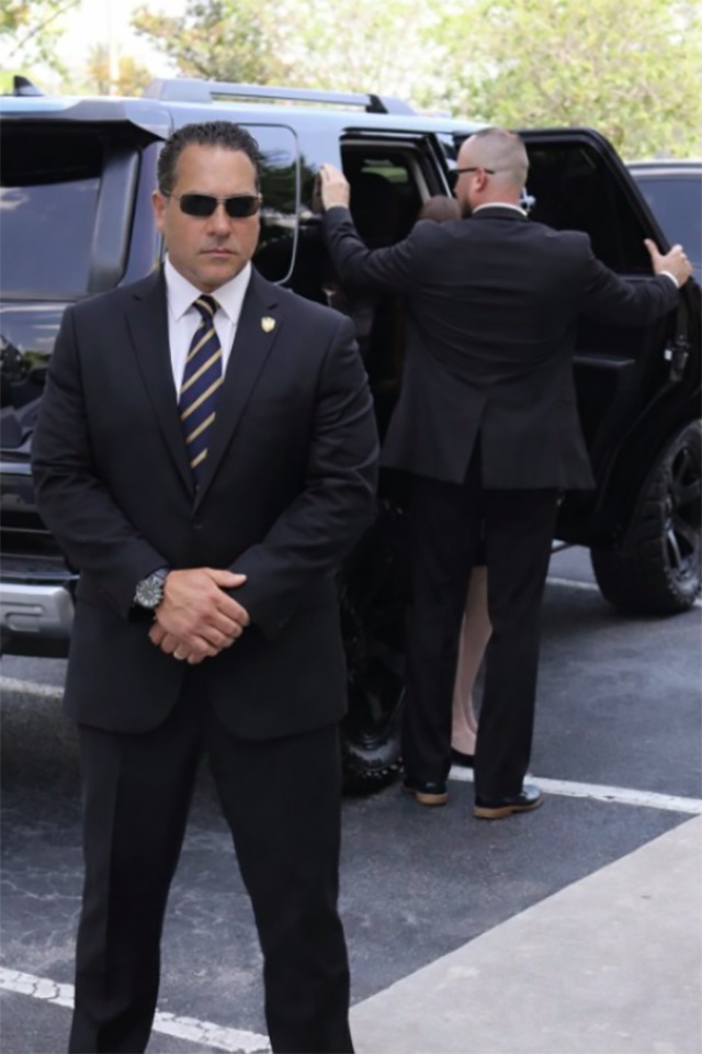 Guardion Protection security guard monitoring restricted area and perimeter fencing.