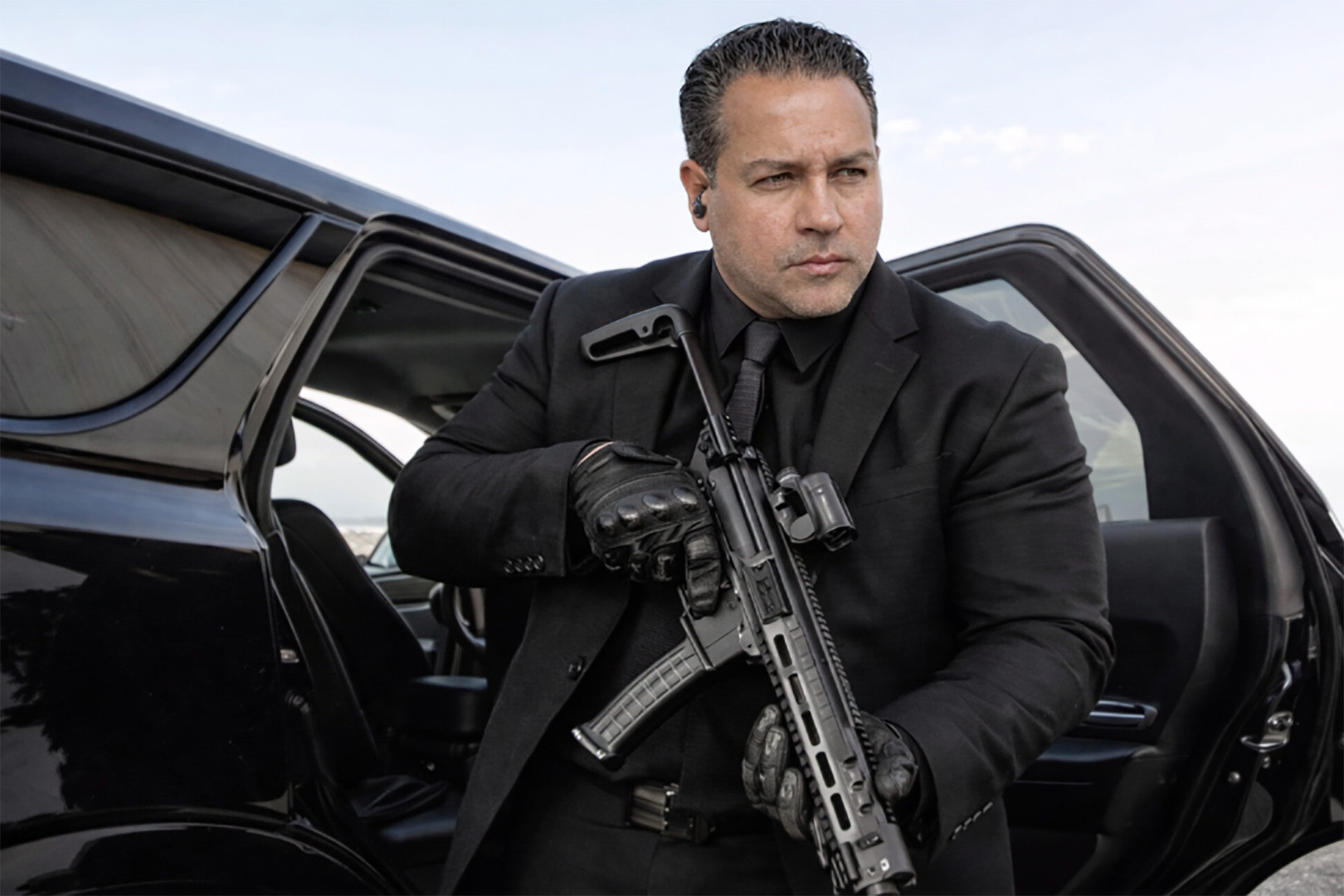 Guardion Protection security guard monitoring restricted area and perimeter fencing.